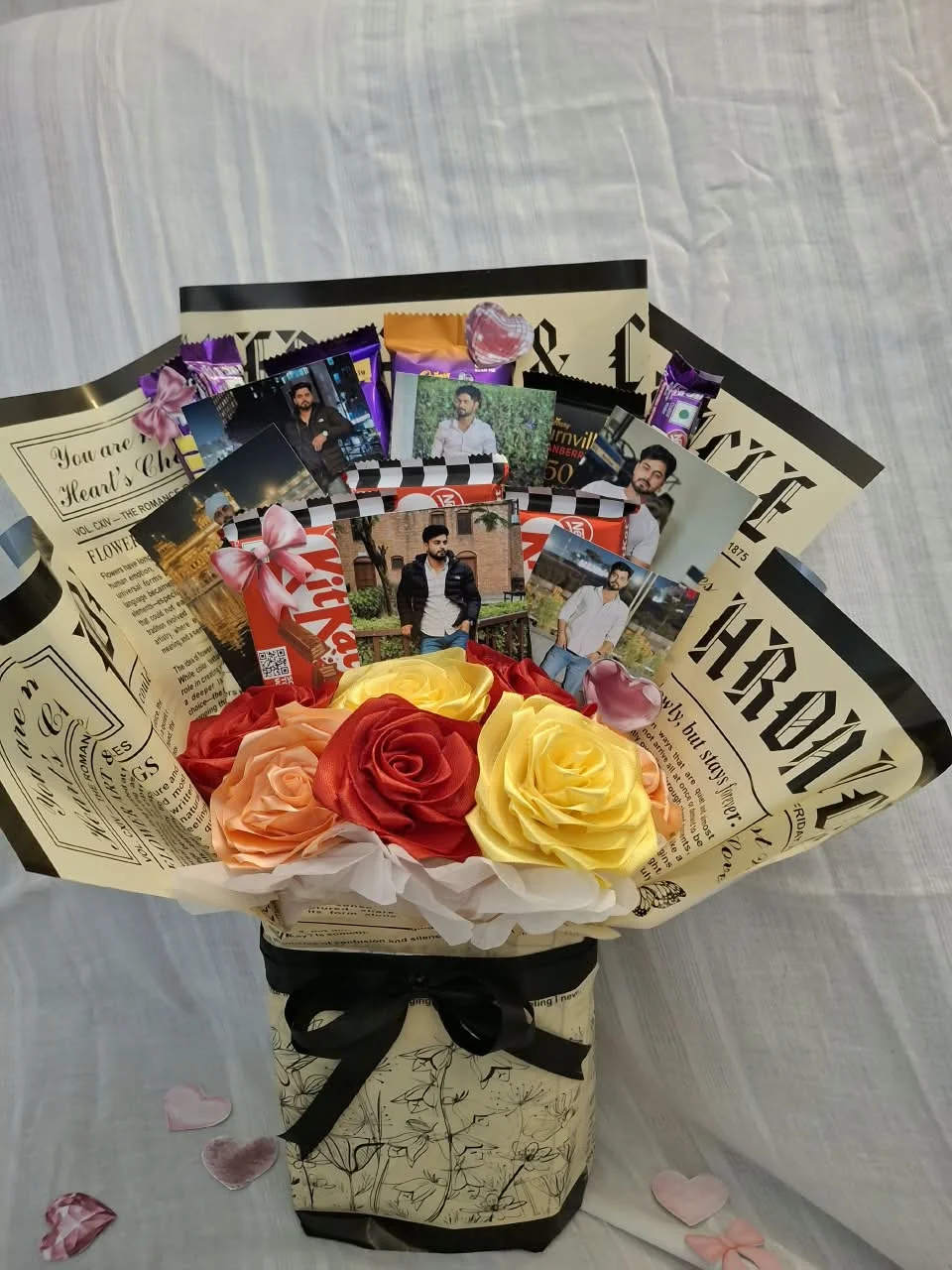 Classic red satin rose bouquet with newspaper wrapper